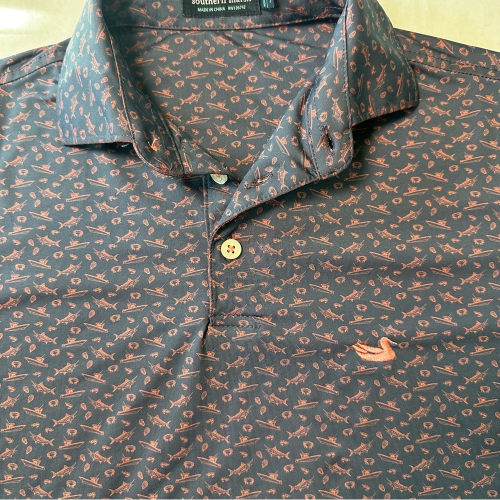 Southern Marsh Kids Polo. Navy with pink fish all over
